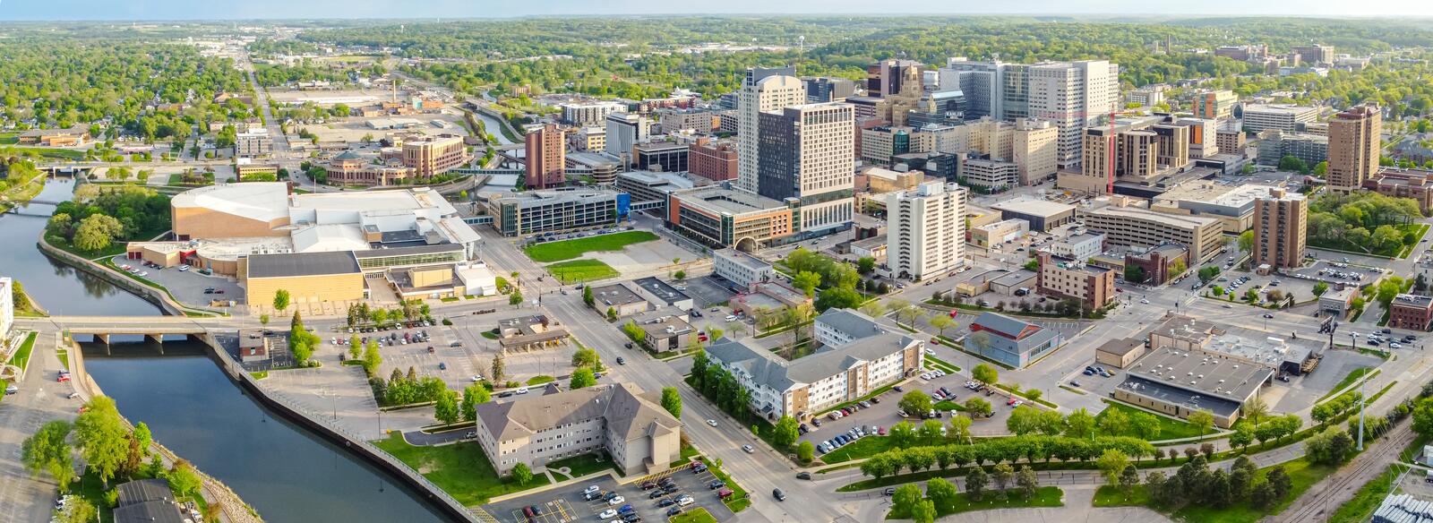 Aerial photo of downtown Rochester, Minnesota, with the river and tree-lined streets.